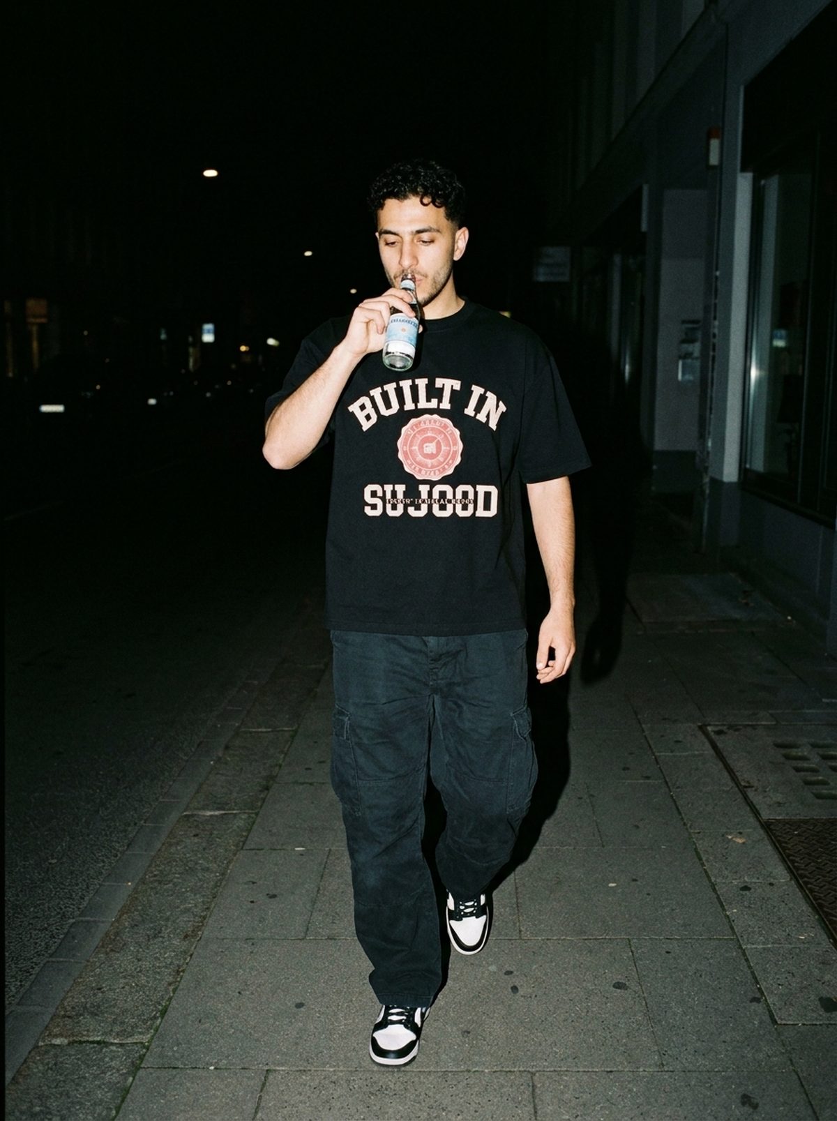 Built in Sujood black tee, night walk